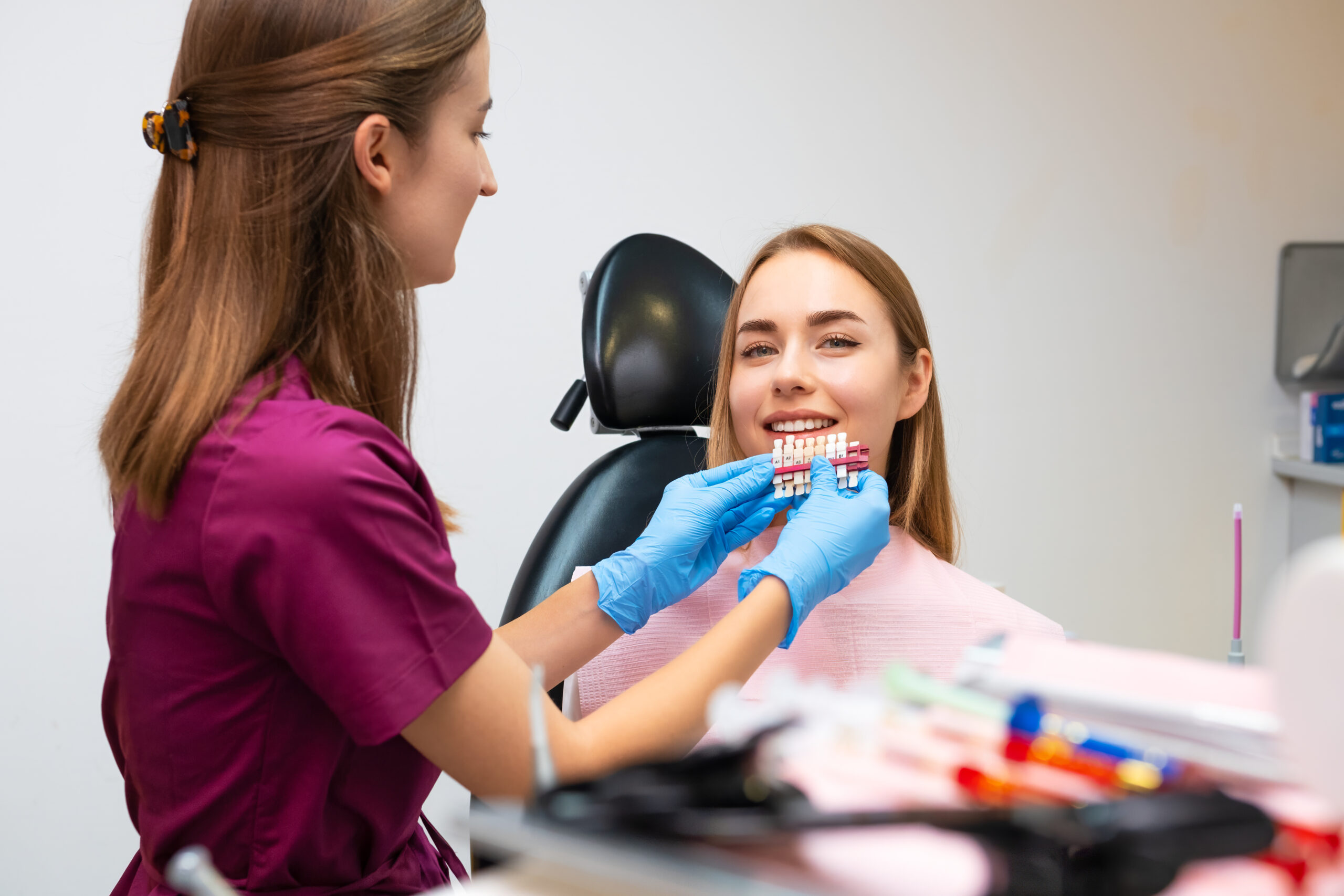 dentist uses shades of tone for whitening of teeth 2023 12 08 21 12 12 utc scaled