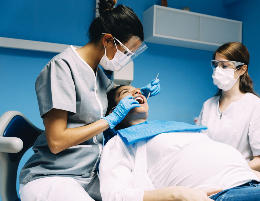 dentists with a patient during a dental interventi 2024 10 18 07 56 18 utc scaled e1734409515839